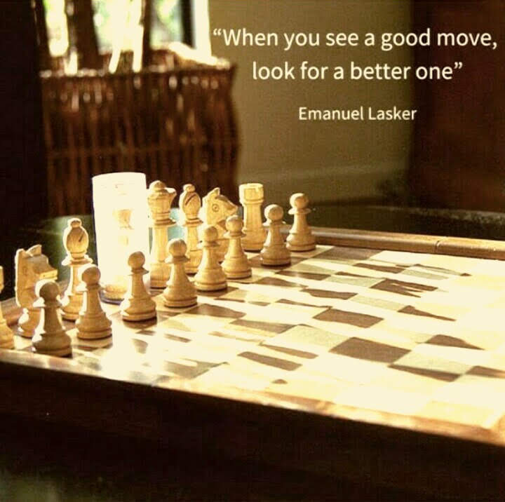 Chessboard with quote by Emanuel Lasker: "When you see a good move, look for a better one"